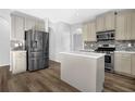 Spacious kitchen with stainless steel appliances, kitchen island, and modern countertops at 5030 Mundy Dr, Cumming, GA 30028