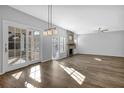Spacious living room with hardwood floors, fireplace, and sliding glass doors at 5030 Mundy Dr, Cumming, GA 30028