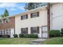 Attractive townhouse with a brick chimney, a tidy lawn and updated windows with dark shutters at 6354 Shannon Pkwy # 30C, Union City, GA 30291