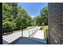 View from the front door to the driveway and lush greenery, showcasing the property's setting at 2110 Fairway Ne Cir, Brookhaven, GA 30319