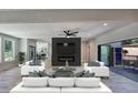 Stylish living room featuring modern furniture, a sleek fireplace, and sliding doors to outdoor deck at 2110 Fairway Ne Cir, Brookhaven, GA 30319