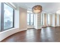 Spacious living area boasts large windows, built-in shelving, and stunning views of the city skyline at 3376 Peachtree Ne Rd # 35A, Atlanta, GA 30326