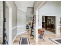 Elegant entryway with hardwood floors and trim details at 5220 Wild Cedar Dr, Buford, GA 30518