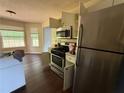Well-equipped kitchen with stainless steel appliances and ample counter space adjacent to dining area at 160 Goldleaf Dr, Hampton, GA 30228