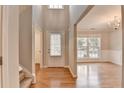 Inviting foyer with hardwood floors, a staircase, and an open view to the living spaces at 2842 Sedgeview Ln, Buford, GA 30519