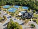 Aerial view of the community clubhouse, swimming pool, tennis courts and ample parking at 3865 Brookhollow Dr, Douglasville, GA 30135