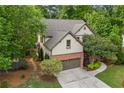 Beautiful house with a two-car garage, neutral siding, mature landscaping, and a driveway at 414 Silver Top Dr, Grayson, GA 30017