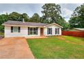 Beautiful single-story home with an established lawn, complemented by a nice yard at 1050 Kirkland Rd, Covington, GA 30016