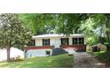 Single-story home with black shutters, brick accent, and a well-maintained front yard at 3086 Lone Oak Sw Ave, Atlanta, GA 30354