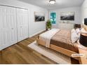 Bedroom with hardwood floors, walk-in closet, and large windows allowing lots of natural light at 355 Marietta Hwy, Roswell, GA 30075