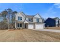 Two-story home with a three-car garage, manicured lawn, and brick facade at 124 Felicity Pike, Locust Grove, GA 30248