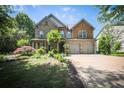 Attractive home exterior with lush landscaping and a spacious driveway at 176 Oakland Way, Dallas, GA 30157