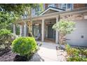 Charming home with a covered front porch and manicured landscaping at 176 Oakland Way, Dallas, GA 30157