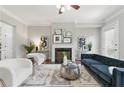 Cozy living room featuring fireplace, hardwood floors, and neutral décor at 2828 Broughton Se Ln, Atlanta, GA 30339