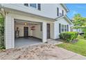 Attached garage with interior access, featuring storage shelves and utility connections for added convenience at 912 Third St, Stone Mountain, GA 30083