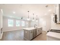 Open-concept kitchen with island, stainless appliances, and views of the living area at 1624 Ruskin Way, Marietta, GA 30062