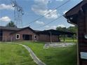 View of an open backyard with covered structure in a grassy area at 3105 Hamilton Mill Rd, Buford, GA 30519