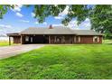 Charming single-story home with a well-maintained lawn and covered carport at 3105 Hamilton Mill Rd, Buford, GA 30519