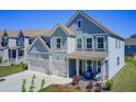 Stylish two-story home featuring a two-car garage, covered porch, and well-maintained landscaping at 42 Citrine Way, Acworth, GA 30101