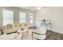 Bright living room with stylish furniture, decorative accents, and ample natural light at 42 Citrine Way, Acworth, GA 30101
