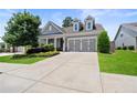 Attractive home with a well-maintained lawn, a two-car garage, and a traditional design at 519 Rosemont Ave, Canton, GA 30115