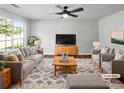 This living room features neutral decor and plenty of natural light at 105 Odyssey Turn, Conyers, GA 30012