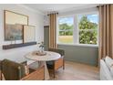 Cozy breakfast nook with large windows and modern decor at 244 Nesta Grove, Locust Grove, GA 30248