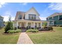 Charming two-story home with a welcoming front porch and beautifully landscaped front yard at 4044 Andover Cir, Mcdonough, GA 30252