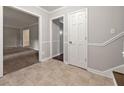 Inviting entryway with neutral tones and tile floors, leading to a spacious carpeted living area at 1415 Hialeah Ct, Marietta, GA 30062