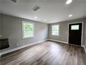 Bright living room featuring modern flooring, fresh paint, and new windows at 1753 Cahoon Sw St, Atlanta, GA 30310