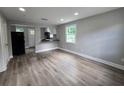 Open-concept living room flowing into the kitchen area, perfect for entertaining at 1753 Cahoon Sw St, Atlanta, GA 30310