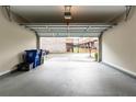 Spacious two-car garage with an open door and ample storage space, ready for your vehicles at 1646 Sandy Beach Pt, Lawrenceville, GA 30043