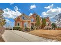 Lovely brick home with well-kept lawn, mature trees, and a long driveway at 2740 Heritage Bend Sw Ct, Grayson, GA 30017