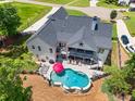 Aerial view of the home's backyard, including a custom pool and outdoor entertaining space at 124 White Oak Trl, Cumming, GA 30028