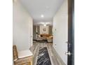 Welcoming entryway with wood-look floors leading into a bright living area, enhanced by a stylish rug and natural light at 217 Limestone Cir, Conyers, GA 30013