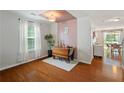 Cozy dining room with hardwood floors and natural light from the window at 3420 Griffin Way, Cumming, GA 30040