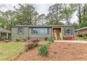 Charming single-story home with an inviting entrance and manicured landscaping at 525 Rosemont Dr, Decatur, GA 30032