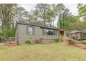 Charming single-story home with an inviting entrance, well-maintained lawn, and mature trees at 525 Rosemont Dr, Decatur, GA 30032