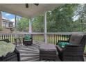 Relaxing screened porch with comfortable seating and views of the backyard at 6240 Vista Crossing Way, Cumming, GA 30028