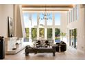 Bright and airy living room with soaring ceilings, a modern fireplace, and beautiful lake views at 2746 Emerald Dr, Jonesboro, GA 30236