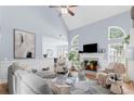 Bright living room with vaulted ceiling, fireplace and elegant furniture arrangement at 5928 Edenfield Nw Dr, Acworth, GA 30101