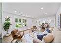 Bright and airy living room featuring hardwood floors, a large window, modern furniture, and an open concept design at 1111 Edgefield Sw Dr, Atlanta, GA 30310
