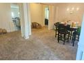 Open floor plan showing living room with adjacent dining and kitchen areas at 4925 Locherby Dr, Fairburn, GA 30213