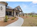Inviting front porch and landscaped yard of this beautiful single-Gathering home at 1609 Tielman Way, Snellville, GA 30078