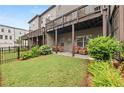 Cozy backyard featuring a patio with outdoor seating and a well-maintained lawn at 3 Hundley Ln, Roswell, GA 30076
