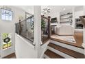 Bright entryway with wooden stairs, a pendant light, and views into the living room at 3 Hundley Ln, Roswell, GA 30076