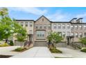 Attractive townhome exteriors with brick and well-manicured lawns offer appealing curb appeal at 3 Hundley Ln, Roswell, GA 30076