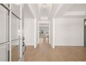 Bright foyer with hardwood floors and white trim, leading to an open floor plan beyond at 3772 Tielman St, Snellville, GA 30078