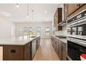 Spacious kitchen with large island, modern stainless steel appliances, and ample cabinet space at 3772 Tielman St, Snellville, GA 30078