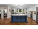 Spacious kitchen with an island, granite countertops, and modern stainless steel appliances at 6990 Brandon Mill Nw Rd, Atlanta, GA 30328